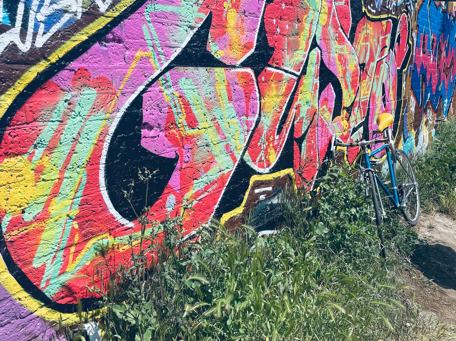 Regents canal in east London, graffiti wall and bike by us